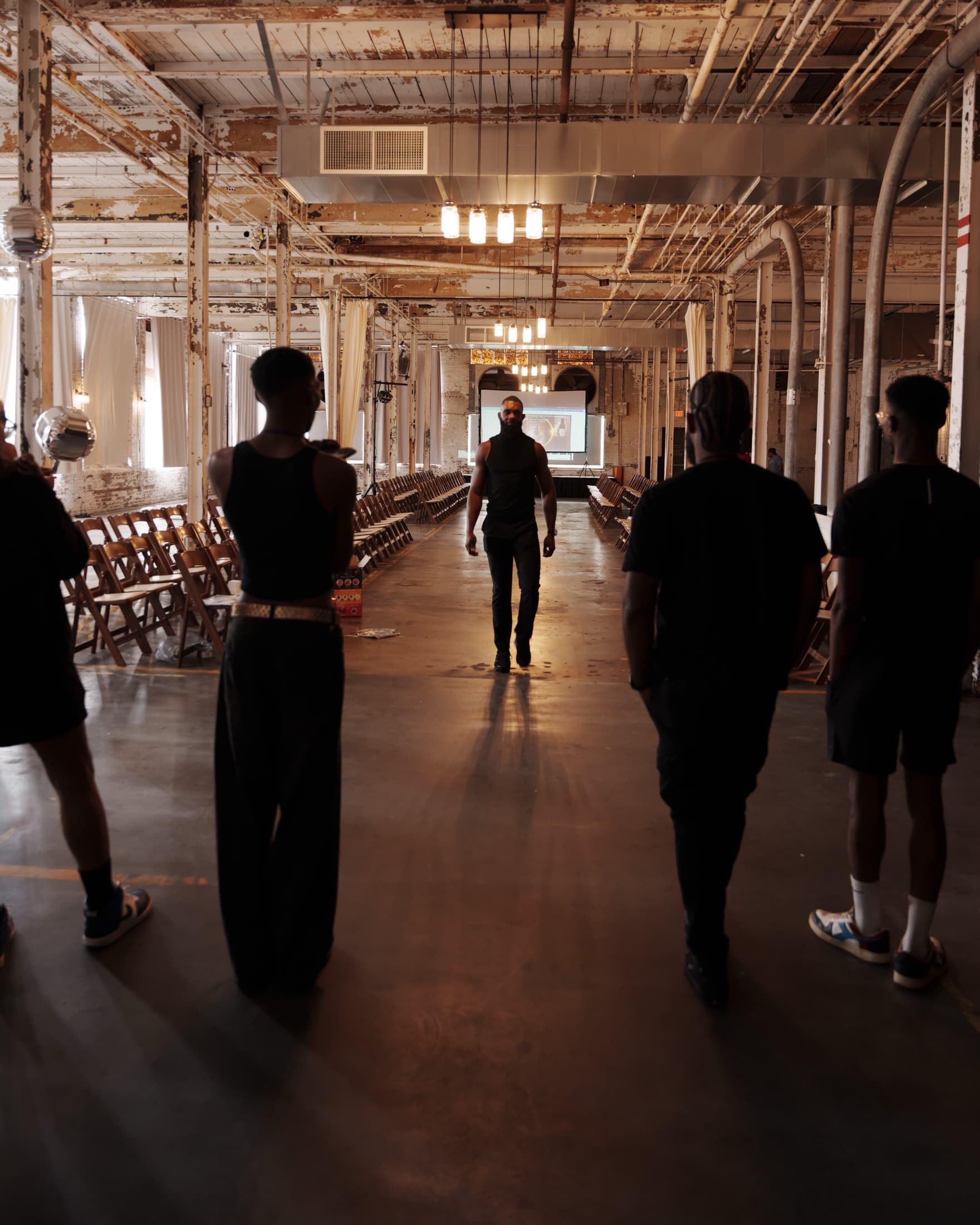 The cast walking the empty runway before doors open