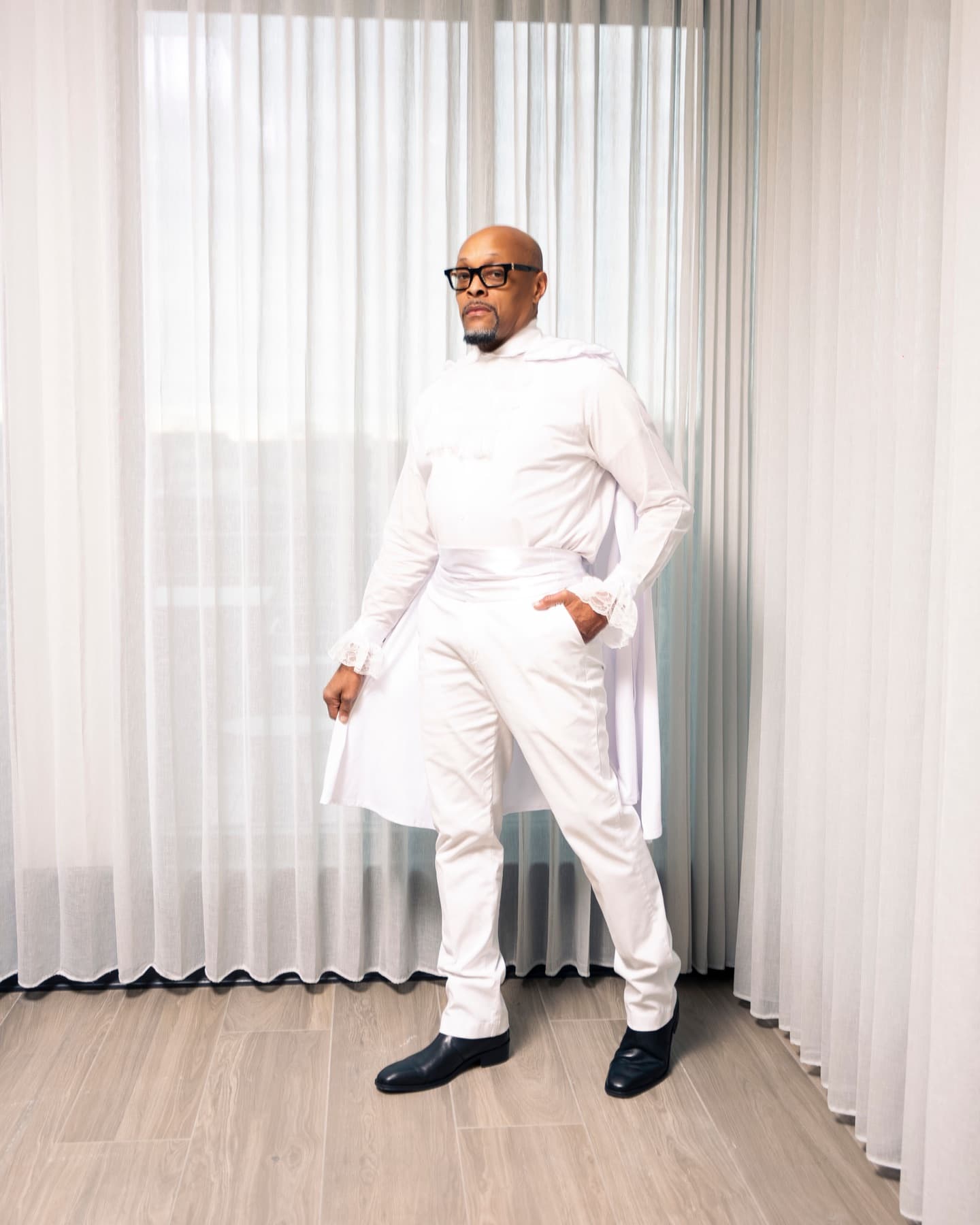 A gentleman in white — the standard